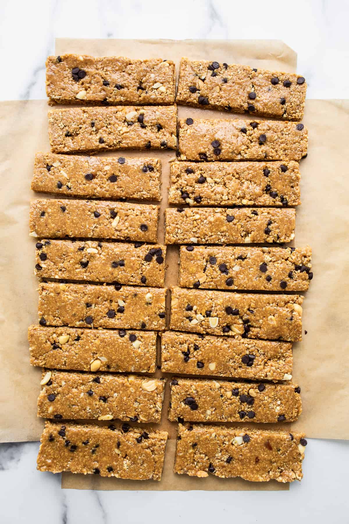 Want a healthy, protein-packed snack on the go? These no bake peanut butter bars will be your new favorite treat! They're crunchy, sweet, salty, and ridiculously easy to make. No bake peanut butter bars cut into bars.