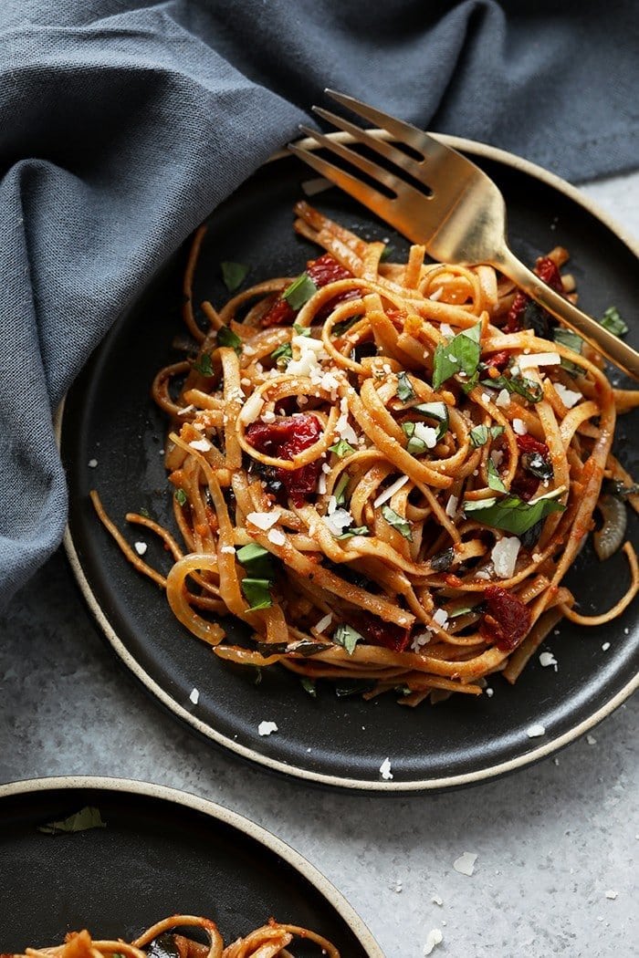 Pasta can be a healthy dinner packed with flavor and deliciousness. Substituting whole wheat pasta, adding vegetables, and creating a flavorful sauce is the key a healthy pasta for dinner. Treat yourself to this Whole Wheat Sun Dried Tomato Basil Pasta. It's light, fresh, and only require a few simple ingredients! vegetarian sun dried tomato pasta with fresh parmesan