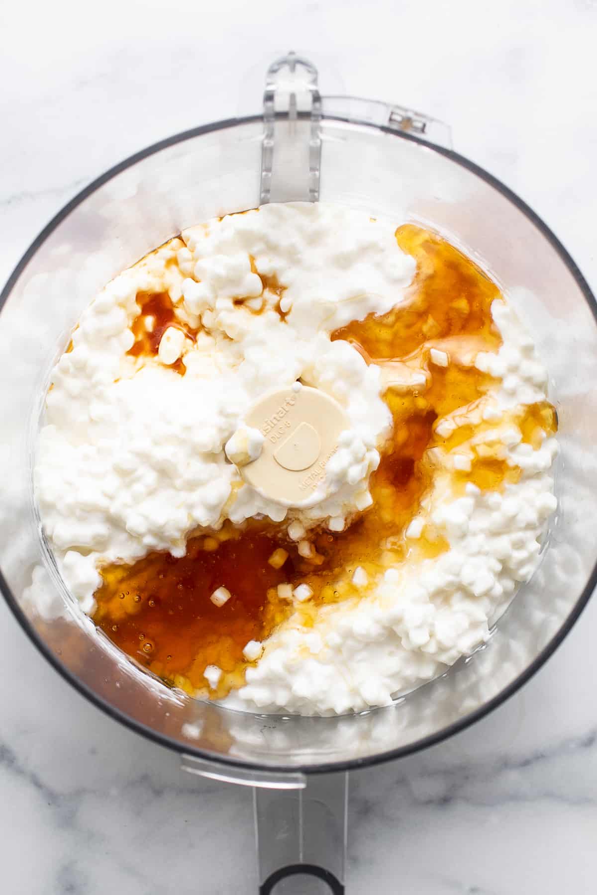 cottage cheese blended smooth in a food processor for making cottage cheese ice cream.