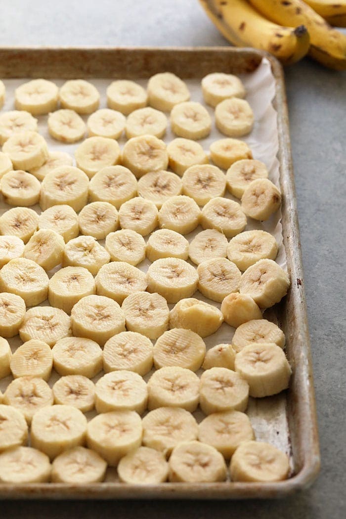 Freeze sliced bananas on a baking sheet