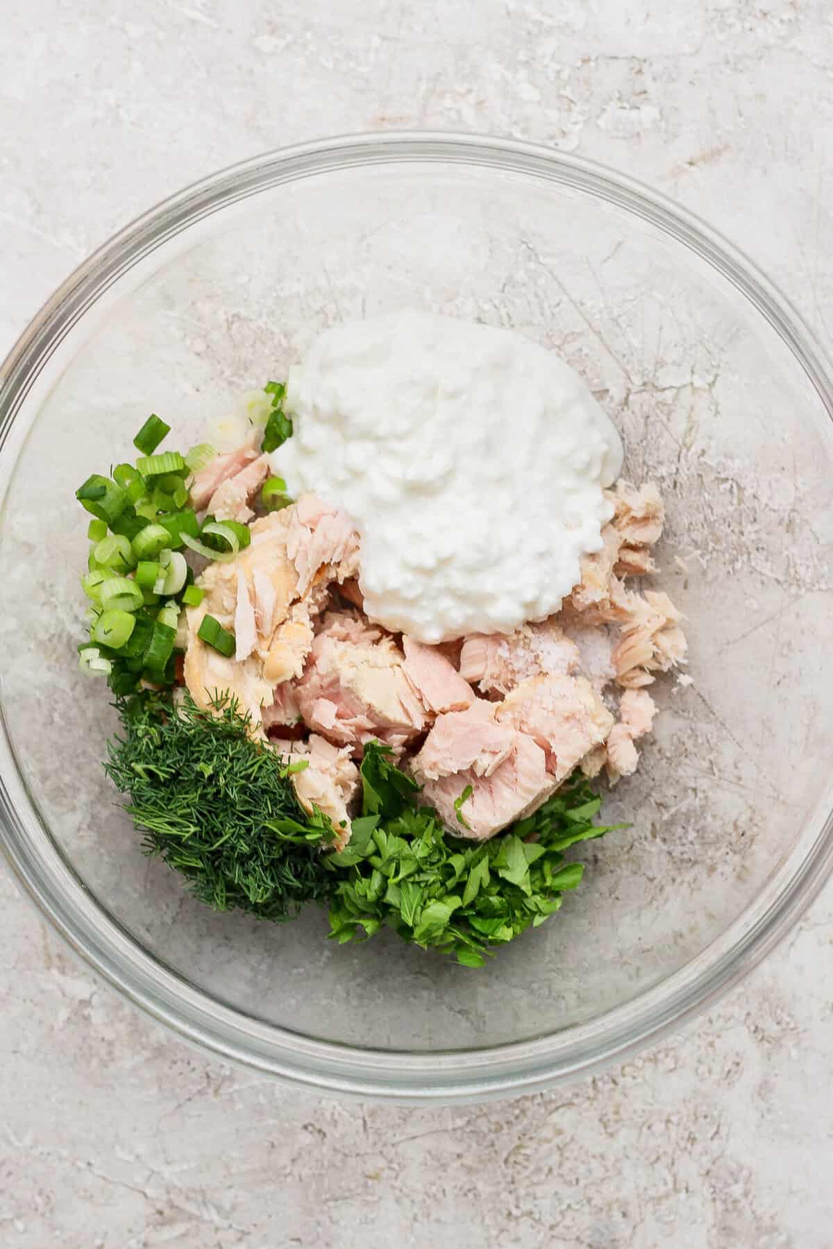 tuna cottage cheese and fresh herbs in mixing bowl