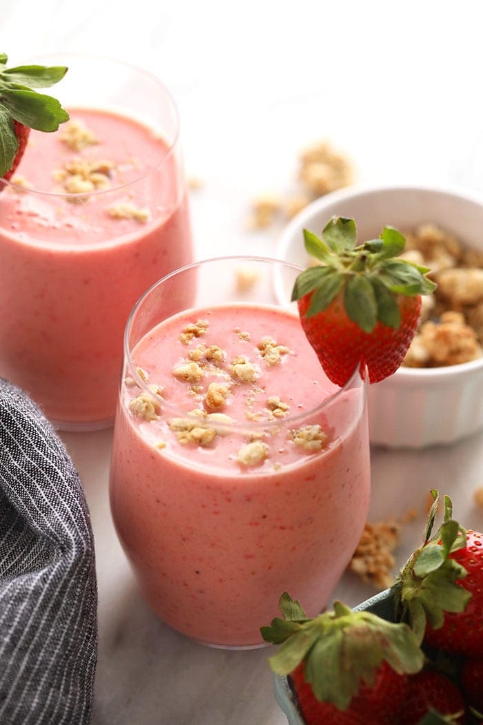 Wake up to this refreshing strawberry smoothie recipe. With just 4 basic ingredients you can have a cafe-worthy creamy strawberry smoothie ready to go in less than 5 minutes. Strawberry smoothie in a glass.