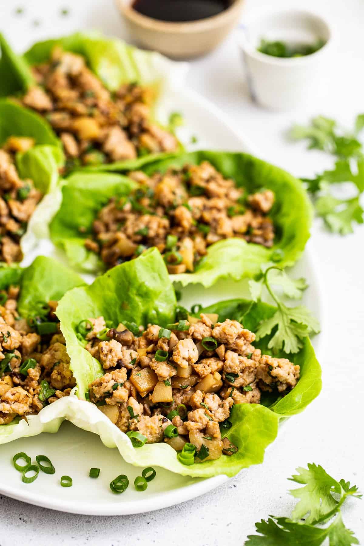 This copycat. PF Chang's Lettuce Wraps recipe is so easy to make in your own kitchen and comes together in less than 30 minutes! PF Chang's lettuce wraps served on a platter.