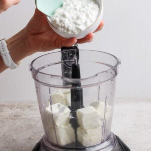 adding cottage cheese to food processor for apple dip