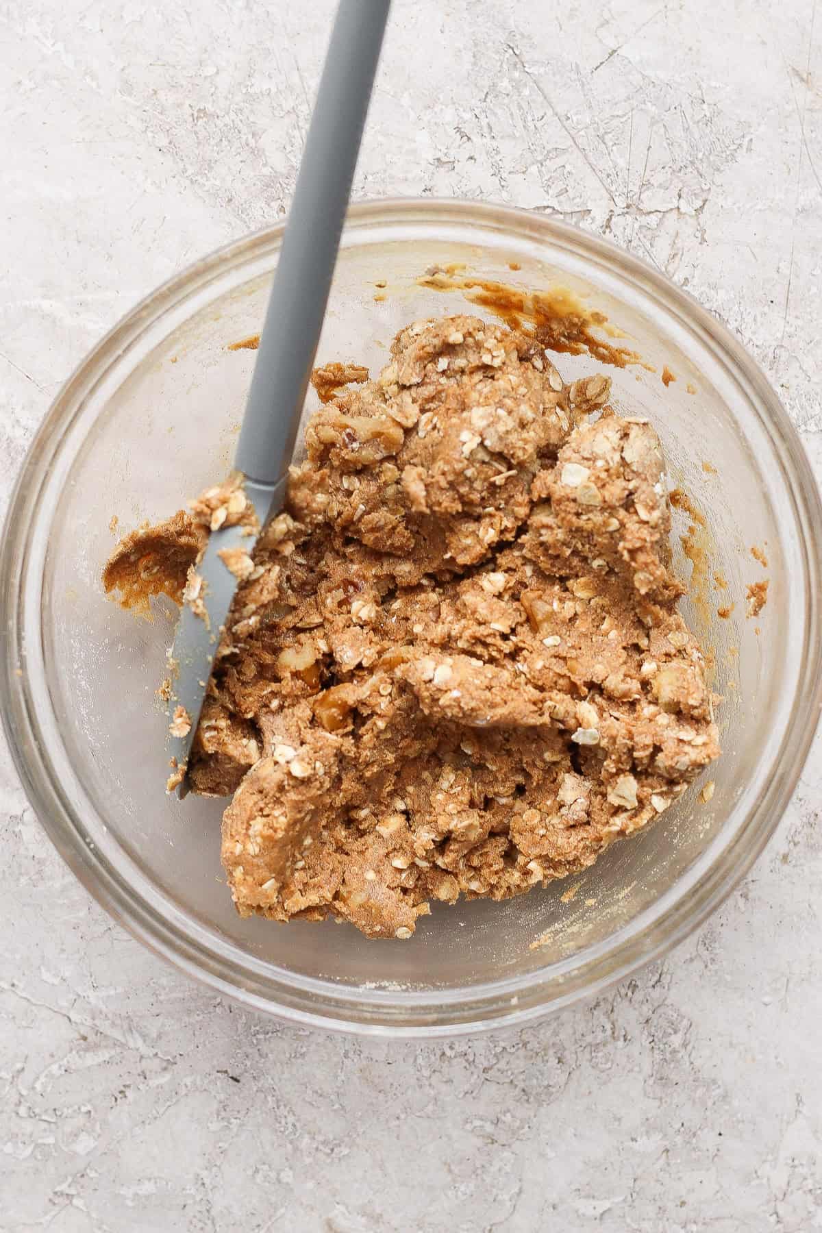 Oat, walnut, protein powder, maple syrup, and nut butter crumble for protein apple crisp.